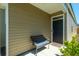 Cozy front porch featuring a comfortable bench and an inviting entrance at 314 Bear Paw Ln, Summerville, SC 29486
