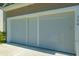 Screened garage door with white trim and the address 314 on the side at 314 Bear Paw Ln, Summerville, SC 29486