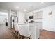 Well-lit kitchen showcasing granite countertops, stainless appliances, grey cabinetry, and barstool seating at 314 Bear Paw Ln, Summerville, SC 29486
