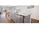 Modern kitchen island with stainless steel appliances and an adjacent dining area at 314 Bear Paw Ln, Summerville, SC 29486