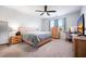Serene bedroom with neutral tones, ceiling fan, and a large window for natural light at 314 Bear Paw Ln, Summerville, SC 29486