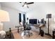Home office with computer setup, musical keyboard, rolling chair, and ample lighting at 314 Bear Paw Ln, Summerville, SC 29486