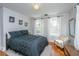 Bright bedroom features wood floors, natural light, and a cozy seating area at 32 Rosedale Dr, Charleston, SC 29407