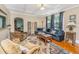 Well-decorated living room with a comfortable sofa, patterned rug, and natural light, creating an inviting and relaxing space at 32 Rosedale Dr, Charleston, SC 29407