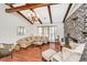 Comfortable living room boasts hardwood floors, brick fireplace, and a cozy sectional sofa at 32 Rosedale Dr, Charleston, SC 29407