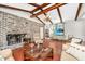 Inviting living room features a brick fireplace and beamed ceilings, creating a cozy ambiance at 32 Rosedale Dr, Charleston, SC 29407