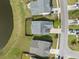 Aerial shot of a well-maintained home featuring a fenced backyard near a serene lake in a neighborhood at 321 Sanctuary Park Dr, Summerville, SC 29486