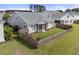 Aerial view showcasing the backyard with a fenced-in area, landscaped surroundings, and a peaceful setting at 321 Sanctuary Park Dr, Summerville, SC 29486