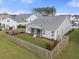 Backyard view with a screened-in porch and a well-maintained lawn surrounded by a wooden fence at 321 Sanctuary Park Dr, Summerville, SC 29486