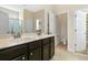 Bathroom features a double sink vanity with dark cabinets, large mirror, and separate toilet room at 321 Sanctuary Park Dr, Summerville, SC 29486
