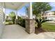 Inviting front porch with brick columns and lush landscaping at 321 Sanctuary Park Dr, Summerville, SC 29486