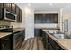 Kitchen featuring modern stainless steel appliances, and dark wood cabinets at 321 Sanctuary Park Dr, Summerville, SC 29486