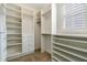 Spacious walk-in closet with custom shelving and drawers at 321 Sanctuary Park Dr, Summerville, SC 29486