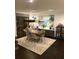 Open dining room features modern pendant lighting, designer rug, and contemporary decor at 330 Concord St # 11B, Charleston, SC 29401