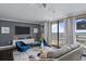 Living room with water views, comfortable seating, TV, and a private balcony at 330 Concord St # 11B, Charleston, SC 29401