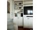 Custom built-in shelving and cabinets offer stylish storage for your home entertainment at 330 Concord St # 6C, Charleston, SC 29401