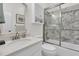 Elegant bathroom with marble countertop, white cabinetry, and a combined shower/tub at 3372 Billings St, Mount Pleasant, SC 29466