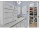 Well-organized bathroom featuring built-in storage, marble countertop, and a bright, airy atmosphere at 3372 Billings St, Mount Pleasant, SC 29466