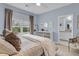 Comfortable bedroom with a calming color palette, large window, and en-suite bathroom at 3372 Billings St, Mount Pleasant, SC 29466