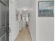 Welcoming hallway with light hardwood floors and stylish artwork leading to the living area at 3372 Billings St, Mount Pleasant, SC 29466