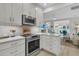 Modern kitchen with white cabinets, stainless steel appliances, and stylish backsplash tile at 3372 Billings St, Mount Pleasant, SC 29466