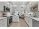 Bright kitchen featuring white cabinets, stainless steel appliances, and stylish backsplash tile at 3372 Billings St, Mount Pleasant, SC 29466