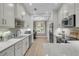 Modern kitchen with white cabinetry, marble countertops, and stainless steel appliances at 3372 Billings St, Mount Pleasant, SC 29466