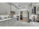 Modern kitchen with white cabinetry, marble countertops, patterned backsplash, and stainless steel appliances at 3372 Billings St, Mount Pleasant, SC 29466
