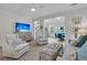 Cozy living room with skylights, plush seating, neutral decor, and an open view to a dining area at 3372 Billings St, Mount Pleasant, SC 29466