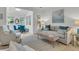 Comfortable living room featuring stylish furniture, a patterned rug, and soft natural light from adjacent dining area at 3372 Billings St, Mount Pleasant, SC 29466