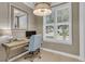 Cozy home office with wood desk, natural light, and stylish window shutters at 3372 Billings St, Mount Pleasant, SC 29466