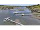 Property with private docks perfect for boating and water activities, surrounded by lush greenery and natural beauty at 3610 Legareville Rd, Johns Island, SC 29455