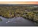 Scenic aerial view featuring waterfront homes with private boat docks and scenic marsh views at 3610 Legareville Rd, Johns Island, SC 29455