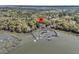 Overhead real estate view of a home on a waterway with multiple docks; aerial view location marker at 3610 Legareville Rd, Johns Island, SC 29455