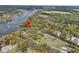 Stunning aerial view of waterfront property with private dock, lush landscaping, and scenic marsh views at 3610 Legareville Rd, Johns Island, SC 29455