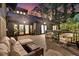 Back deck with outdoor seating, perfect for enjoying evenings with views of the home's exterior at 3610 Legareville Rd, Johns Island, SC 29455