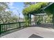 Inviting back deck with pergola, American flag, and views of the water at 3610 Legareville Rd, Johns Island, SC 29455