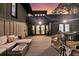 Evening view of back patio with wood decking, comfortable seating, and inviting atmosphere at 3610 Legareville Rd, Johns Island, SC 29455