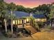 Gorgeous home boasting a spacious outdoor deck perfect for entertaining and outdoor relaxation at 3610 Legareville Rd, Johns Island, SC 29455