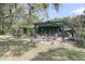 Enjoy outdoor living in backyard featuring a covered patio, hammock, and lush greenery at 3610 Legareville Rd, Johns Island, SC 29455