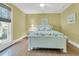 Bright bedroom with a queen-size bed, wood floors, and a large window offering natural light at 3610 Legareville Rd, Johns Island, SC 29455