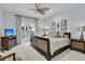 Bright bedroom featuring a king-size bed, neutral carpet, and private deck access at 3610 Legareville Rd, Johns Island, SC 29455