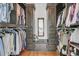 Walk-in closet with a center bench and ample storage at 3610 Legareville Rd, Johns Island, SC 29455