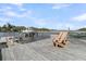 Relax on the dock with waterfront views from boat lift, hammock, and adirondack chairs at 3610 Legareville Rd, Johns Island, SC 29455