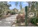 Picturesque property entrance with a long driveway and attractive signage at 3610 Legareville Rd, Johns Island, SC 29455