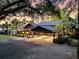 Exterior view of home featuring a porte-cochere and ample parking space at 3610 Legareville Rd, Johns Island, SC 29455