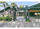 Inviting home entrance with a pergola-covered walkway and covered carport at 3610 Legareville Rd, Johns Island, SC 29455