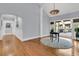 Inviting foyer with hardwood floors, and a view of the outdoor deck through sliding glass doors at 3610 Legareville Rd, Johns Island, SC 29455