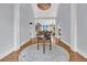 Grand foyer featuring a round table, hardwood floors, and elegant light fixtures at 3610 Legareville Rd, Johns Island, SC 29455