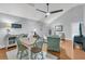 Open-concept room with dining table, ceiling fan, and seating area with views at 3610 Legareville Rd, Johns Island, SC 29455